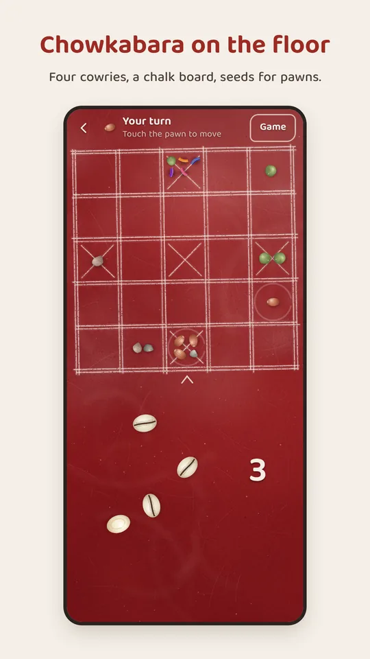 Chowkabara on the red floor: the chalk board, the pawns and four cowries thrown.